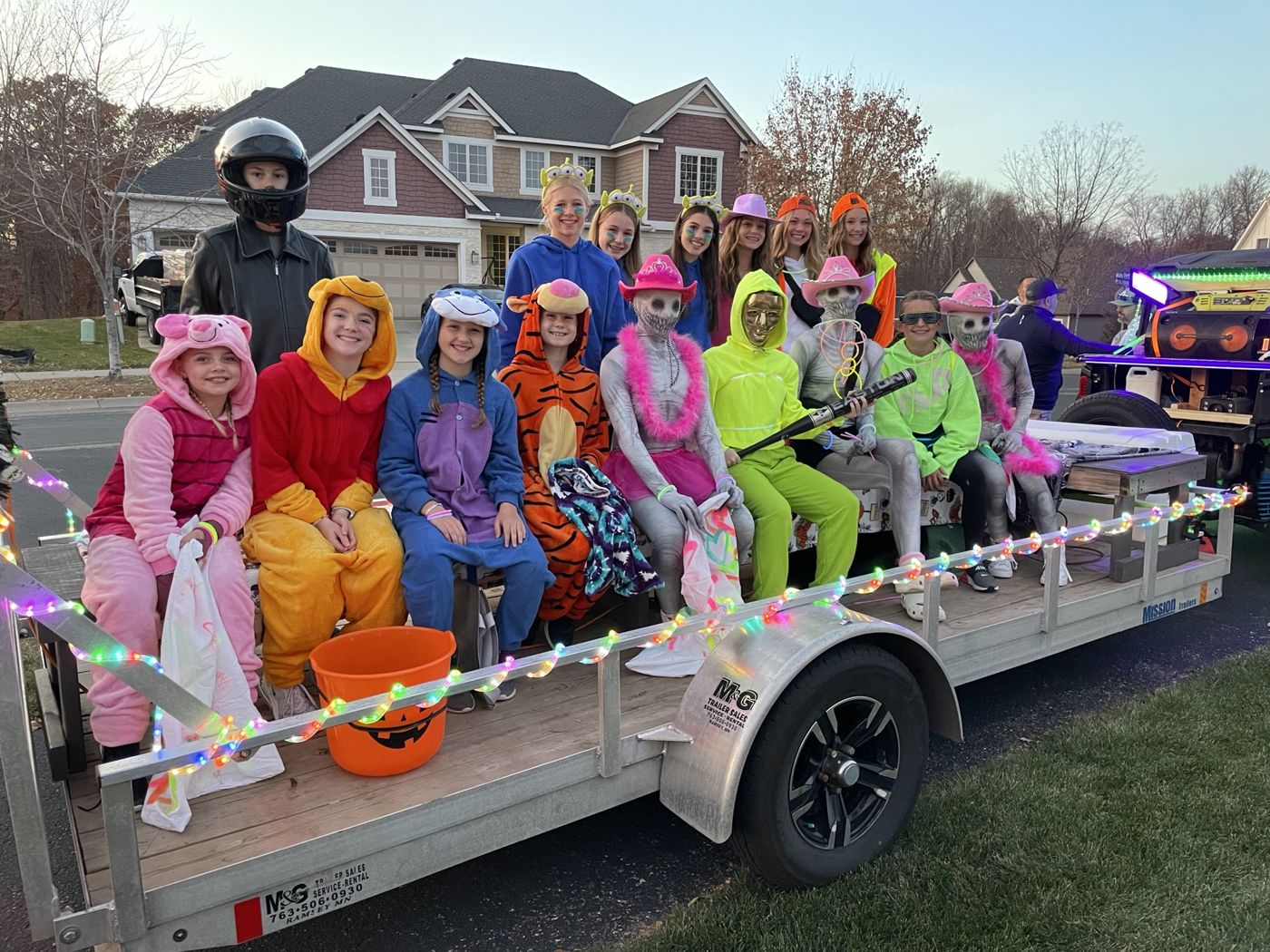 A trailer full of kids in costumes ready to ride the Party Wagon